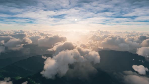 view of clouds over the mountains from a passenger plane