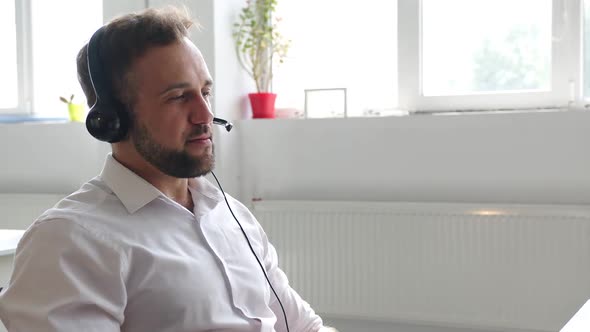 Back View of a Young Office Worker in a Company alt