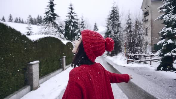 A Beautiful Smiling Girl Whirling in Slow Motion alt