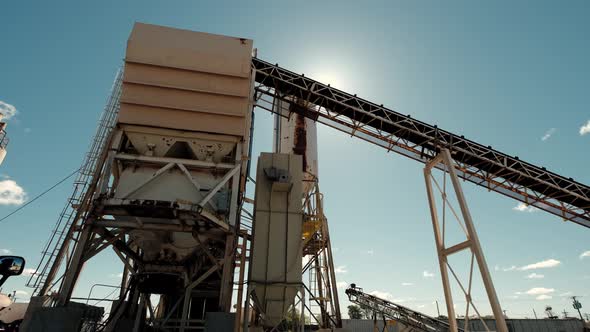 Cement Factory Buildings and Big Reservoirs with Materials Against Industrial Town at Hills Foot alt
