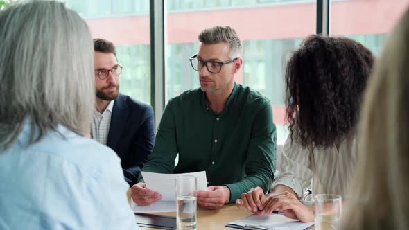 Businessman Handshaking Partner at Group Meeting Making Business Agreement alt