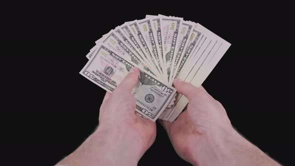 Male Hands Holding a Fan of a Lot of 50 Dollar Bills with Alpha Channel alt