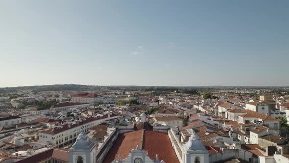 Aerial pullback reveal Santo Antão Church, Evora Famous Giraldo Square, Alentejo