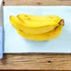 Bananas and knife on napkin