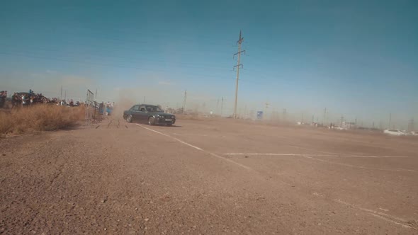 Drifting car, professional driver drifting car on asphalt race track. smoke and dust