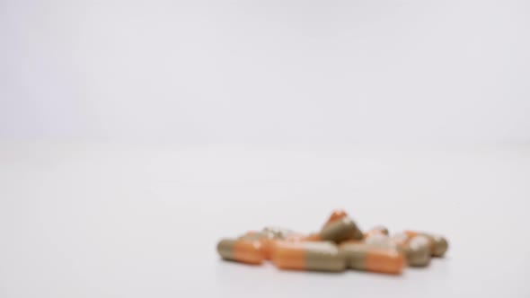 Medical capsules on white background. Follow focus alt