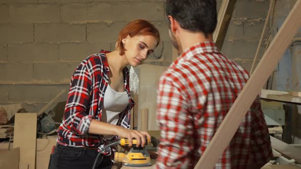 Two Carpenters Working on Wood Plank at the Workshop 1080p alt