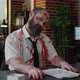 Creepy Zombie Office Worker with Deep and Bloody Face Wounds Smirking Bizarre at Camera - VideoHive Item for Sale