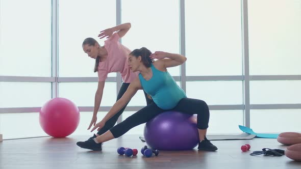 The Expectant Mother is Taking Care of Her Health Preparing for Childbirth alt