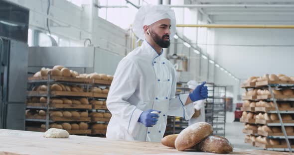Funny Dancing Baker in a Bakery Industry While alt