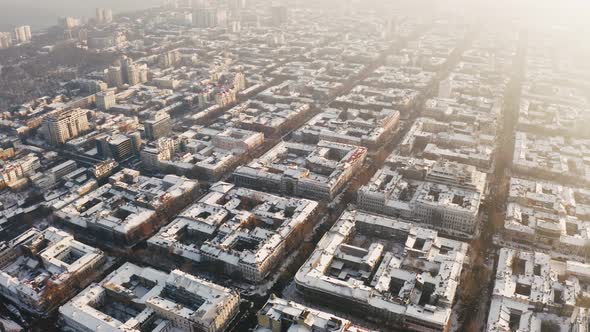 Aerial View of Old City Center During Sunny Winter Day alt