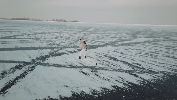 Stylish Young Woman Professional Dancer Dancing Energetic Jazz Funk or Hip Hop on Arctic Frozen Lake alt