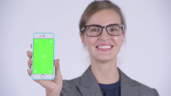 Face of Young Happy Businesswoman Showing Phone alt