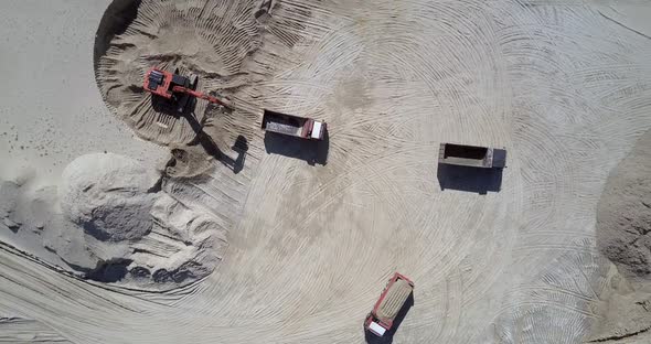 Excavator Fills Tipper with Ore at Sand Quarry Aerial View alt
