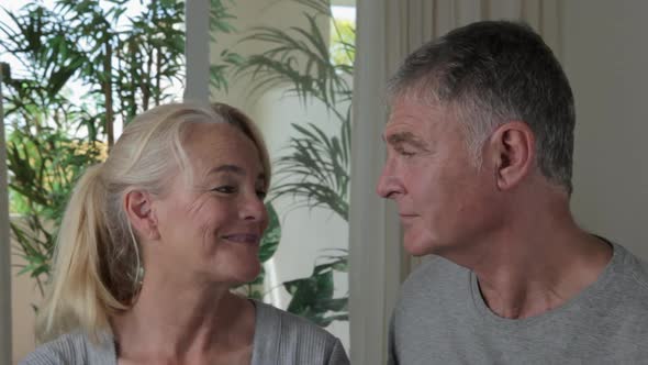 Close up of mature couple smiling at each other alt