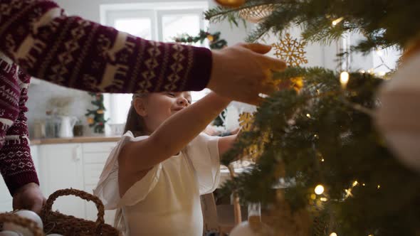 Family decorating home for the Christmas. Shot with RED helium camera in 8K alt