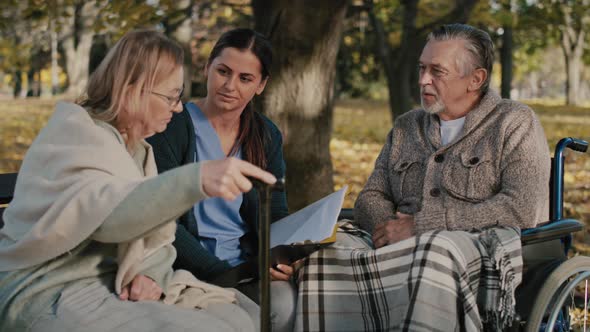 Female nurse analyzing results with her patients. Shot with RED helium camera in 8K alt
