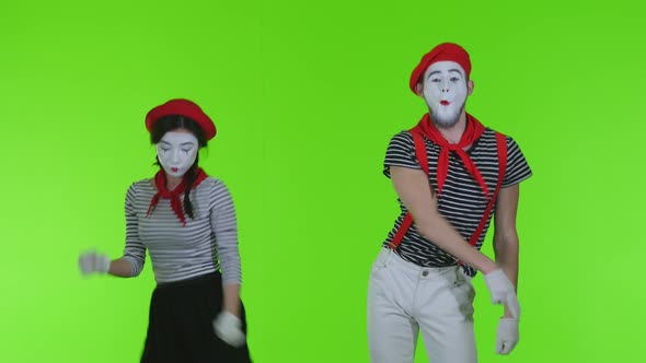 Mimes Are Dancing On A Green Background