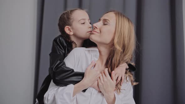 Mother and Daughter Embracing