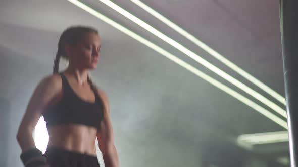 Female Fighter Warms Up and Jumps Before Training in the Boxing Gym Strength Fit Body alt