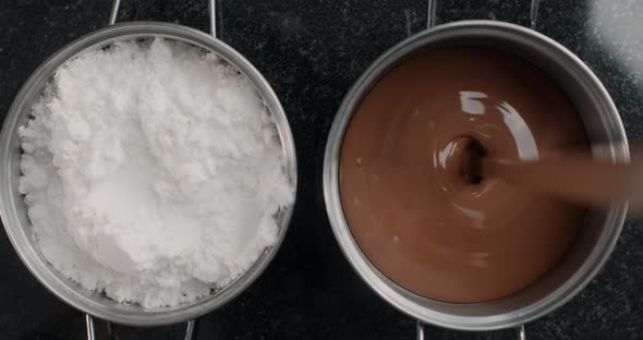 Tabletop Shot: Chef Chocolatier Pours Out Melted Milk Chocolate To the Metal Bowl, Confectioner Uses alt