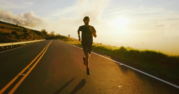 Athletic Man Running at Sunset