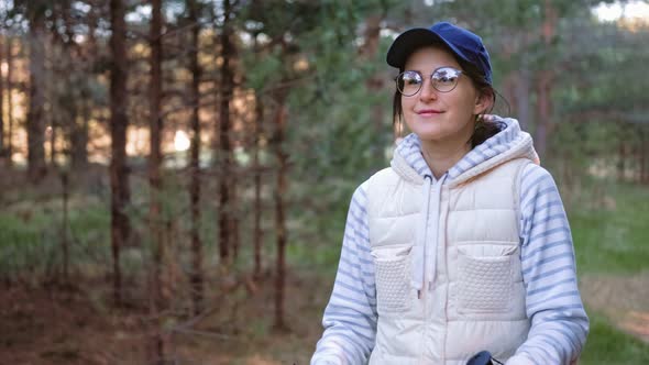 Active Hiker Woman During Nordic Walking at Forest with Trekking Poles alt