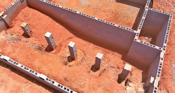 Aerial Down View on Construction Site with Concrete Blocks for House Foundation alt
