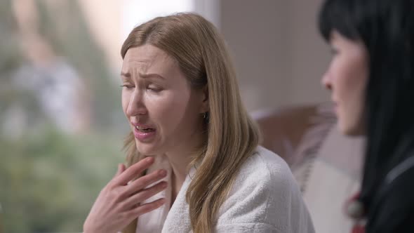Desperate Hopeless Woman Crying Talking with Empathetic Friend Supporting Sad Lady Passing Paper alt