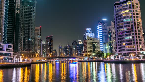 View of Dubai Marina Towers and Canal in Dubai Night Timelapse alt