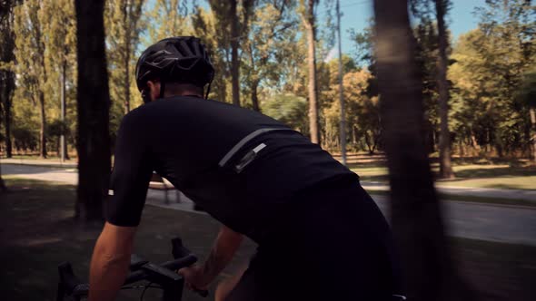 Cyclist Fitness Riding On Road Bike And Getting Ready For Triathlon.Hard Workout.Fit Athlete Workout alt