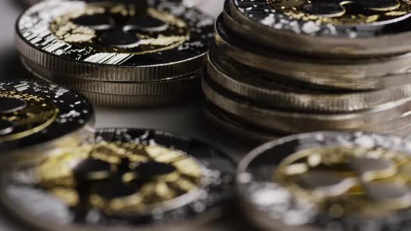 Rotating shot of Bitcoins (digital cryptocurrency) - BITCOIN RIPPLE  alt