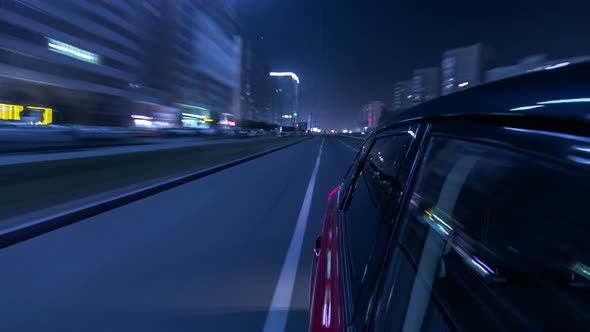 Drivelapse Urban Look From Fast Driving Car at a Night Avenue in a City Timelapse Hyperlapse alt