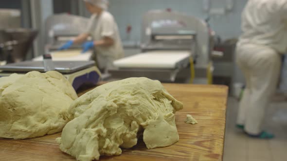 Female Pastry Chefs Work in the Manufacture of Products Made From Dough alt