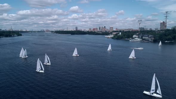 Bird's Eye View of Yachts Racing Across the River