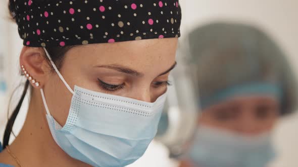 Portrait of Beautiful Young Woman Female Doctor Wearing Medical Face Mask alt