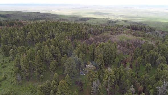 Aerial view of campsite in the Idaho forest viewing scars from wildfire alt
