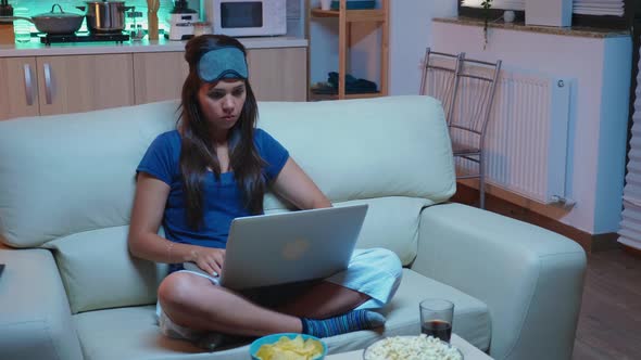 Woman Writing an Email at Night alt