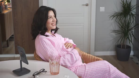 Expectant Mother, Pregnant Woman Tenderly Embracing and Stroking Her Tummy alt