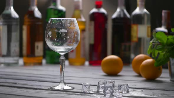 Glass Beside Ice Cubes. alt