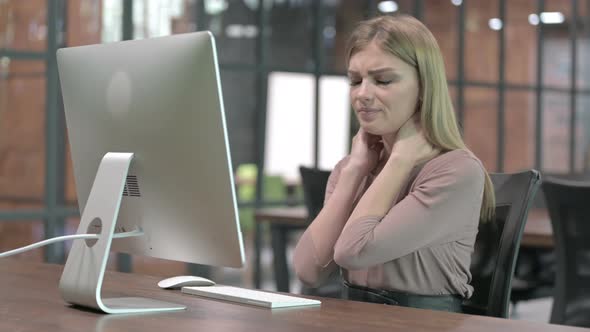 Tired Woman Having Neck Pain While Working on Computer alt