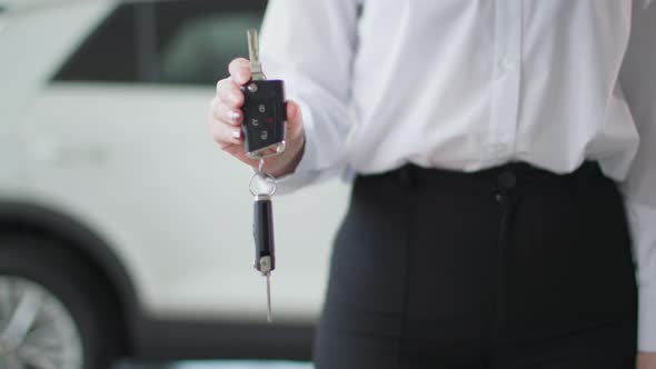 Car Dealership Young Woman Automobile Sales Manager Holding Auto Keys Closeup