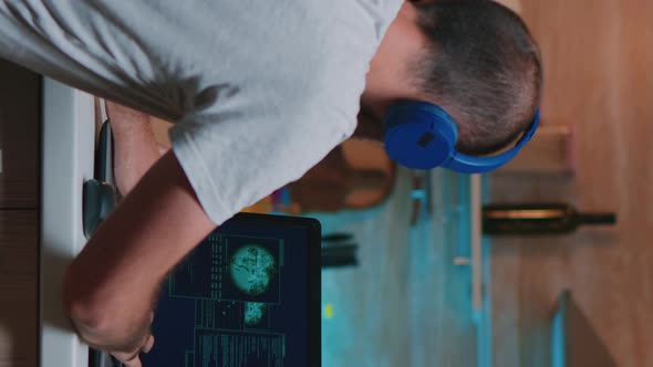 Vertical Video Man Hacker Coding Html and Programming on Screen Laptop alt