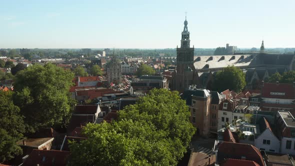 World Renowned Sint Janskerk Church And Ancient Town Hall In Gouda District, Netherlands. Drone Pull alt