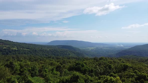 Aerial view camera panning to the forest and mountain by drone