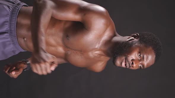 Muscular African American Shirtless on Isolated Dark Background alt