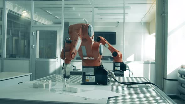 Laboratory with Robotic Devices Doing Easy Tasks alt