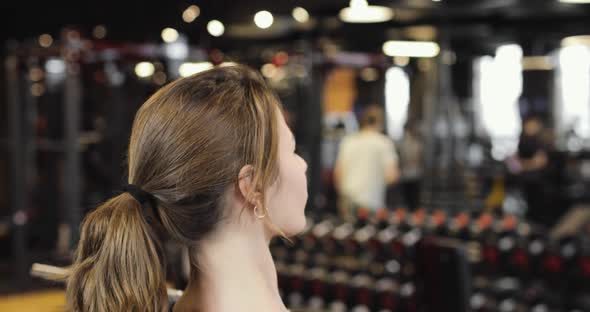 Closeup of a Beautiful Athletic Woman Doing Barbell Exercises