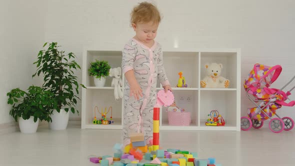 The Child Plays with Toys in the Room alt