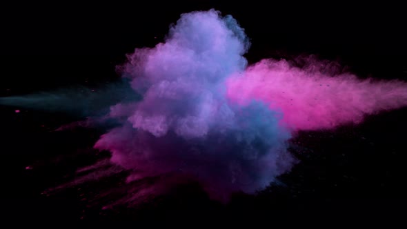 Super Slowmotion Shot of Color Powder Explosion Isolated on Black Background alt